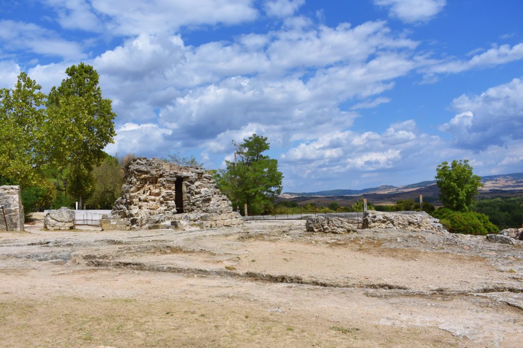 The ruins of an ancient mill standing on the dry ground